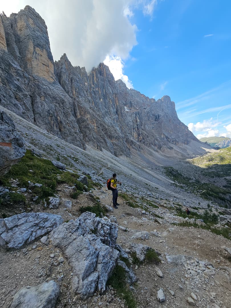 Standing still on the trail beneath the Civetta wall